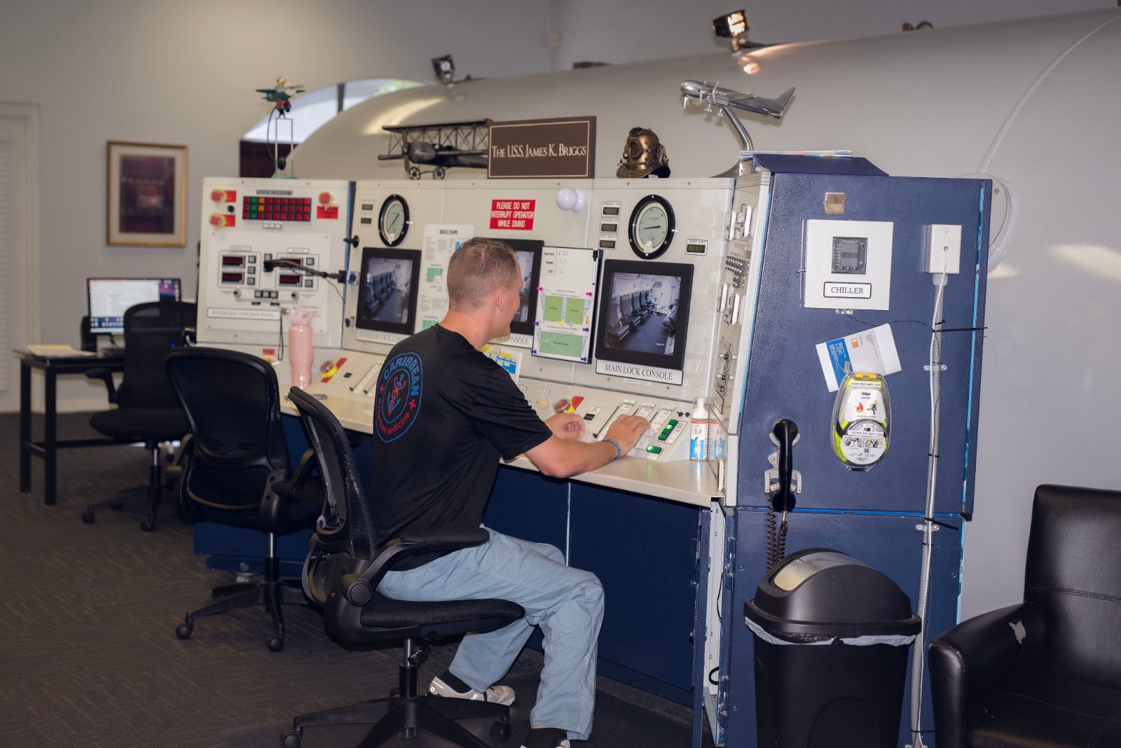 Operator at the chamber control console